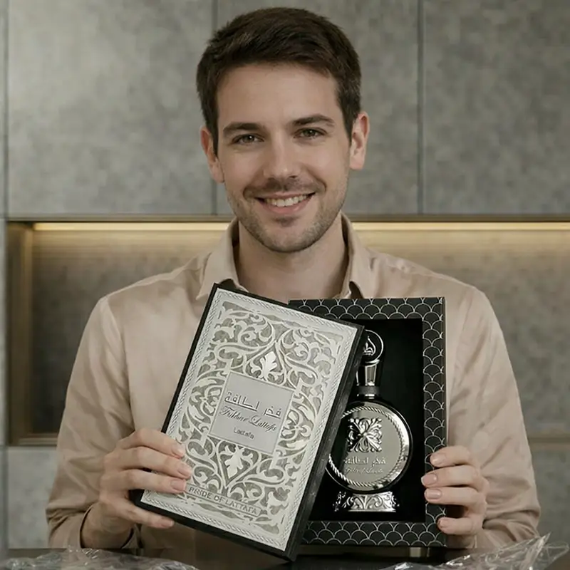 Open box presentation of Lattafa Fakhar Eau de Parfum showing bottle inside packaging