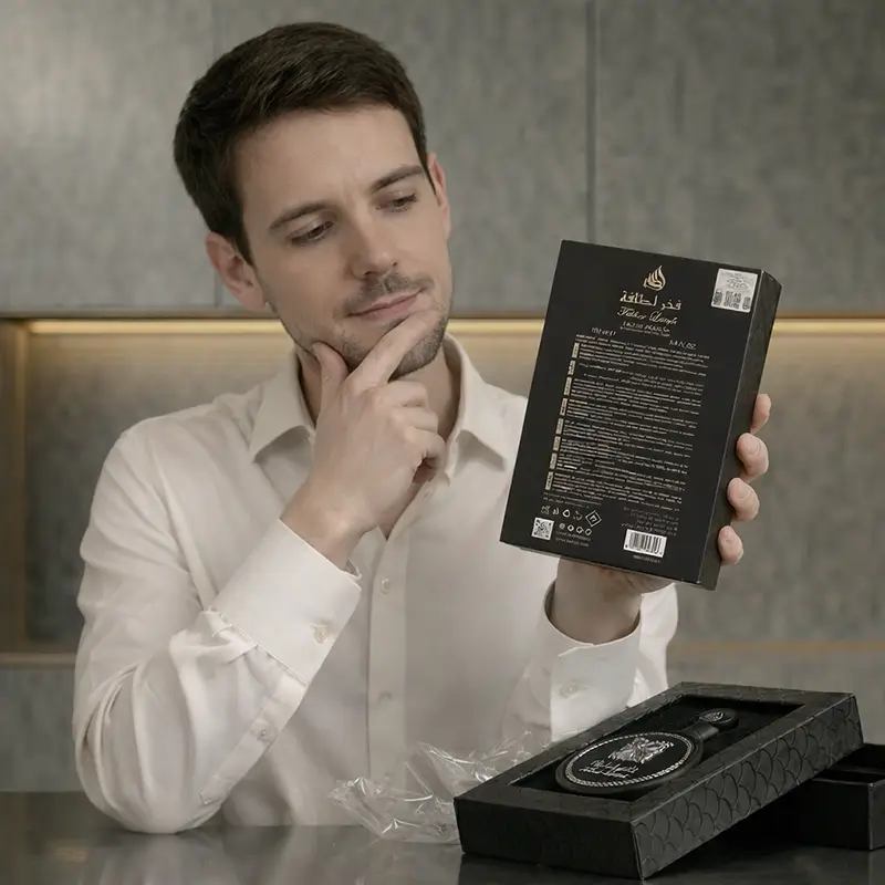 Back of Lattafa Fakhar Eau de Parfum box showing ingredients and barcode details