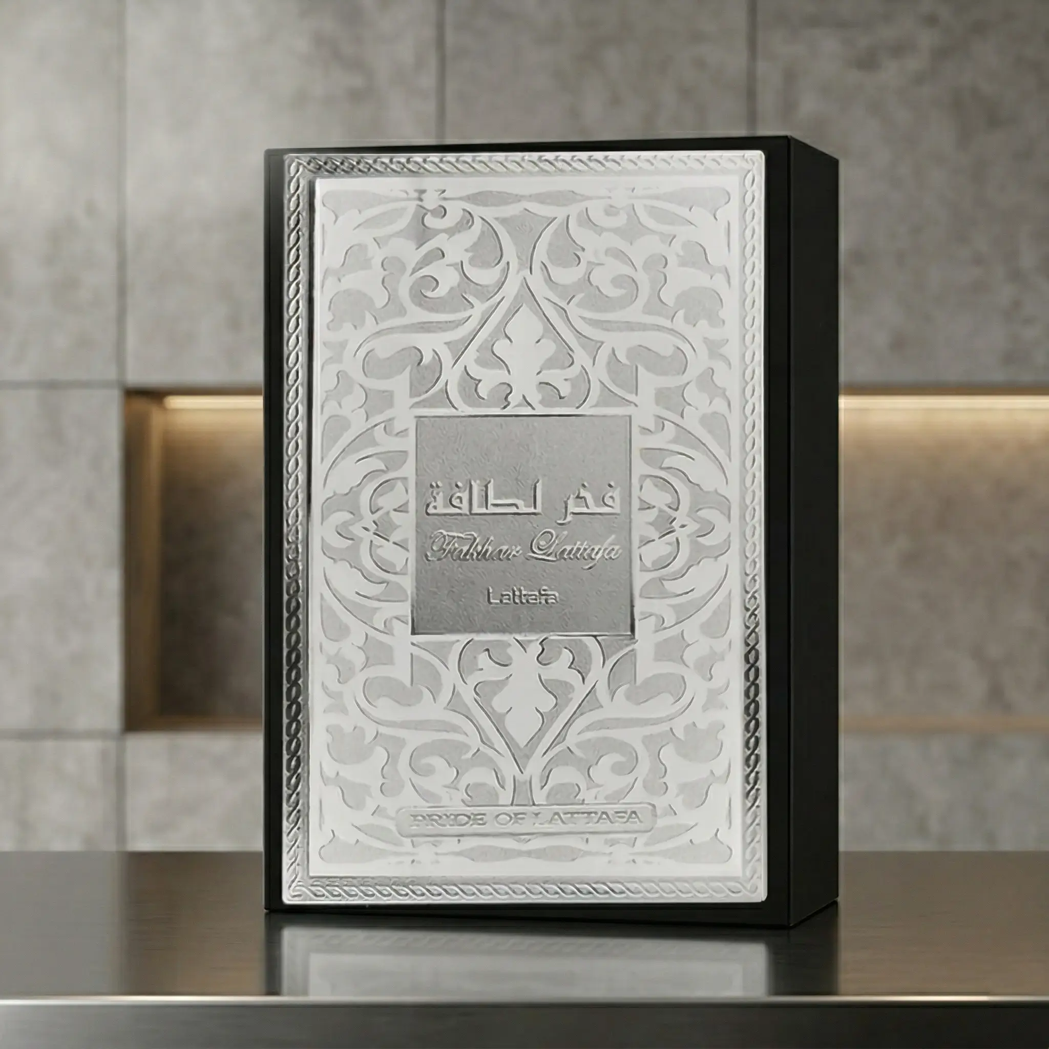 Lattafa Fakhar Eau de Parfum bottle displayed beside decorative luxury packaging box