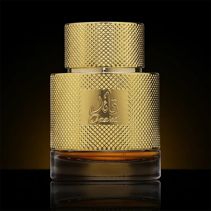 Close-up of the iconic gold-patterned Lattafa Qaa'ed 100ml bottle, a premium unisex amber scent.