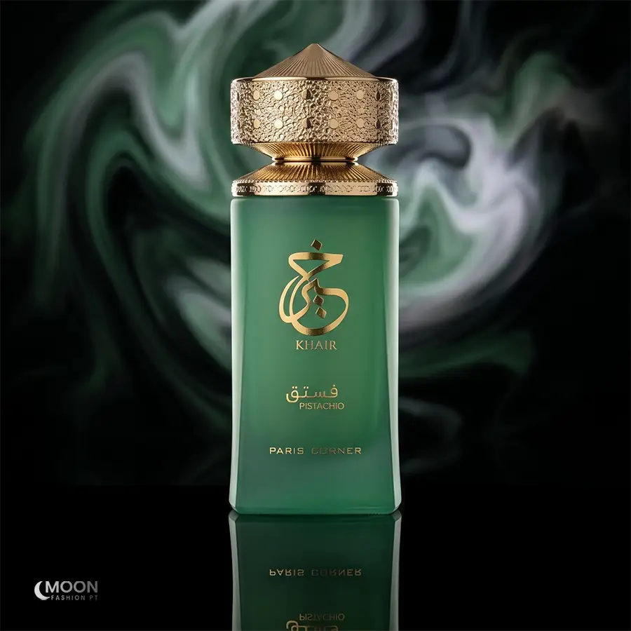 Matte green frosted bottle of Paris Corner Khair Pistachio unisex fragrance against a smoky emerald background.